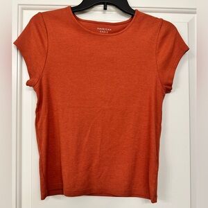 American Eagle Hey Baby Orange Ribbed T-Shirt. Brand new, never worn. Size L.